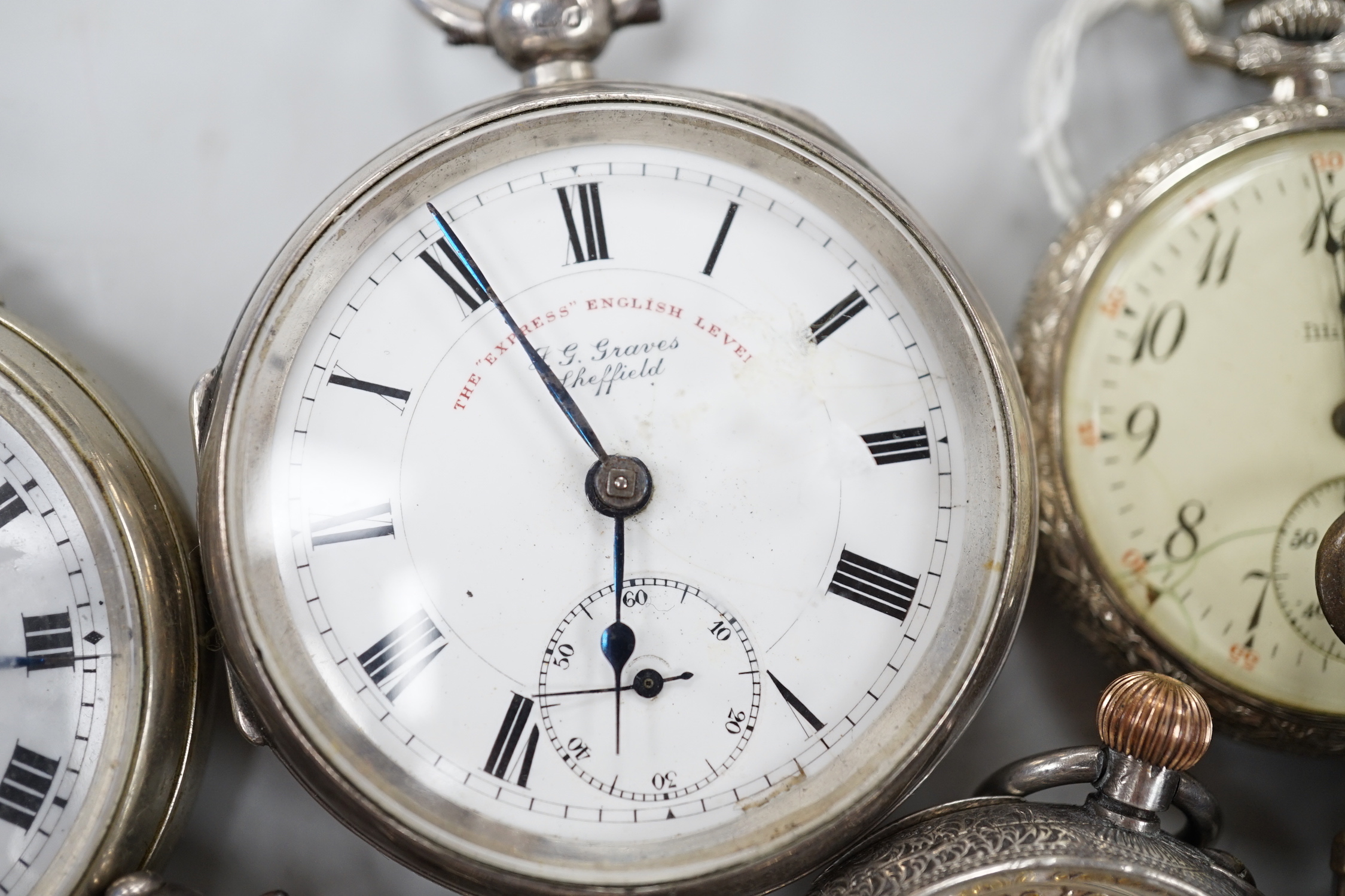 Thirteen assorted pocket and fob watches including silver Exchange and silver J.W. Benson.